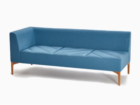 A light blue NaughtOne Hatch Modular Seating with right armrest and wooden base, viewed at an angle. A light blue NaughtOne Hatch Modular Seating with right armrest and wooden base, viewed at an angle.