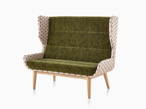 Hush Sofa with a Maharam Paul Smith Lychee Dots outer textile, a dark green inner textile, and a wood base. Hush Sofa with a Maharam Paul Smith Lychee Dots outer textile, a dark green inner textile, and a wood base.
