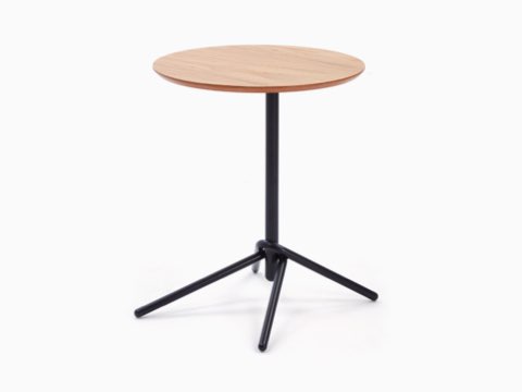 A NaughtOne rectangular Knot Side Table with an oak veneer top and black base, viewed at an angle. A NaughtOne rectangular Knot Side Table with an oak veneer top and black base, viewed at an angle.
