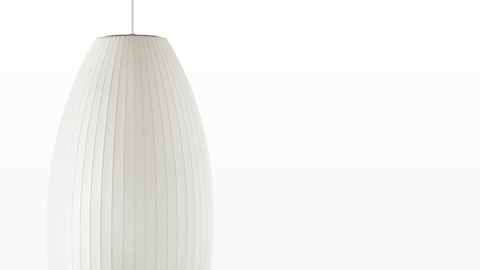 Close view of the shade on a medium Nelson Cigar Bubble Pendant white hanging lamp. Close view of the shade on a medium Nelson Cigar Bubble Pendant white hanging lamp.