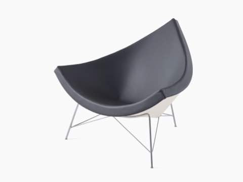 A black leather Nelson Coconut Lounge Chair, viewed from a 45-degree angle. A black leather Nelson Coconut Lounge Chair, viewed from a 45-degree angle.