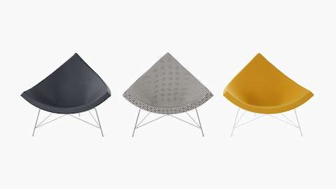 Three Nelson Coconut Lounge chairs facing forward and placed side by side. The left chair is dark grey, the middle black and white checkerboard and right is yellow. Three Nelson Coconut Lounge chairs facing forward and placed side by side. The left chair is dark grey, the middle black and white checkerboard and right is yellow.