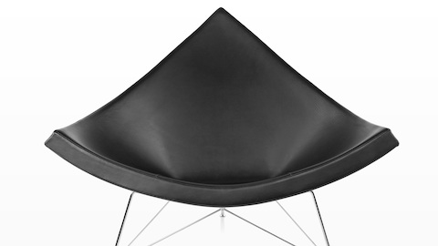 Close view of a black leather Nelson Coconut Lounge Chair, highlighting its resemblance to a chunk of coconut. Close view of a black leather Nelson Coconut Lounge Chair, highlighting its resemblance to a chunk of coconut.