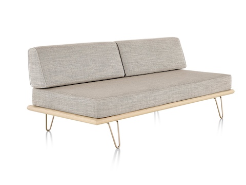 A light gray Nelson Daybed in the sofa position, viewed from a 45-degree angle. A light gray Nelson Daybed in the sofa position, viewed from a 45-degree angle.