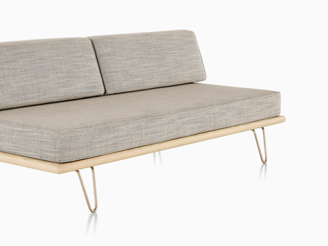 A light gray Nelson Daybed in the sofa position, viewed from a 45-degree angle. A light gray Nelson Daybed in the sofa position, viewed from a 45-degree angle.