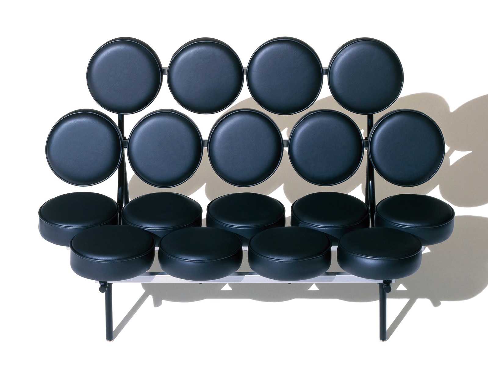 A black leather Nelson Marshmallow Sofa, viewed from the front. A black leather Nelson Marshmallow Sofa, viewed from the front.