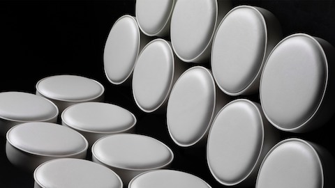 An angled view of a white leather Nelson Marshmallow Sofa, showing how the round cushions seem to float. An angled view of a white leather Nelson Marshmallow Sofa, showing how the round cushions seem to float.