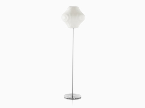 The upper portion of a white Nelson Pear Lotus Floor Lamp. The upper portion of a white Nelson Pear Lotus Floor Lamp.