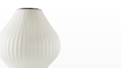 Close view of the white shade on a Nelson Pear Tripod Lamp. Close view of the white shade on a Nelson Pear Tripod Lamp.