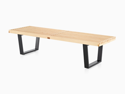 Light maple Nelson Platform Bench with ebonized wood legs, viewed from an angle. Light maple Nelson Platform Bench with ebonized wood legs, viewed from an angle.