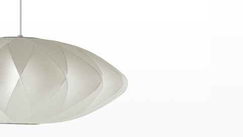 Close up of the shade of a Nelson Saucer CrissCross Bubble Pendant lamp. Close up of the shade of a Nelson Saucer CrissCross Bubble Pendant lamp.