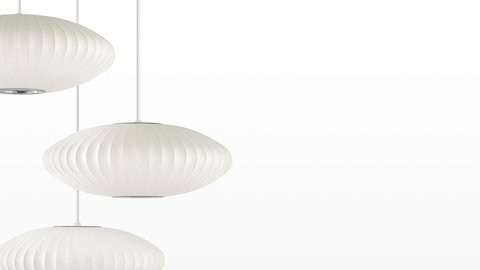 Three Nelson Saucer Bubble Pendants hanging from the same fixture. Three Nelson Saucer Bubble Pendants hanging from the same fixture.
