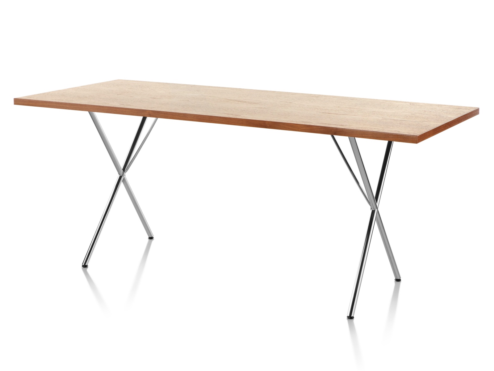 A Nelson X-Leg Table with a light veneer top and chrome legs, viewed from a 45-degree angle. A Nelson X-Leg Table with a light veneer top and chrome legs, viewed from a 45-degree angle.