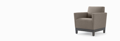 Front three-quarter view of a gray Brava Platform Lounge chair on wood base. Front three-quarter view of a gray Brava Platform Lounge chair on wood base.