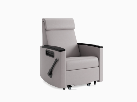 A Consoul Reclining Glider in gray upholstery with black arm caps. A Consoul Reclining Glider in gray upholstery with black arm caps.