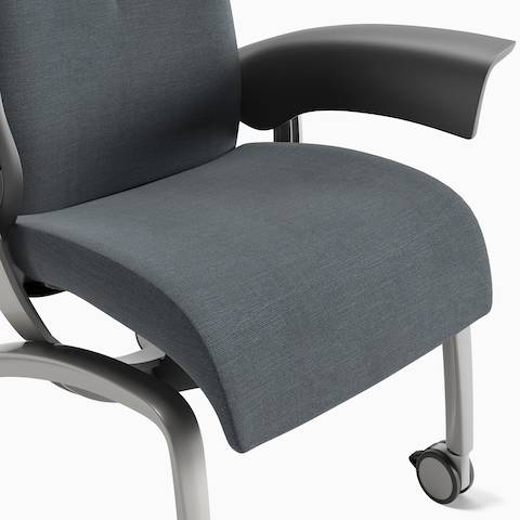 Detail of the gray blue cushion of a Nala Patient Chair and the open arms. Detail of the gray blue cushion of a Nala Patient Chair and the open arms.