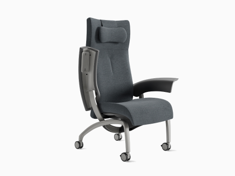 A Nala Patient Chair in gray blue textile with one arm up. A Nala Patient Chair in gray blue textile with one arm up.