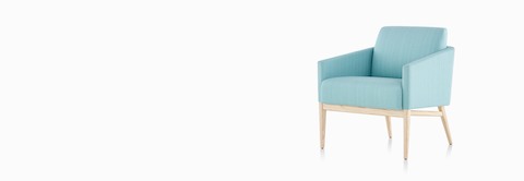 A Palisade Lounge Chair in turquoise fabric with a light wood frame. A Palisade Lounge Chair in turquoise fabric with a light wood frame.