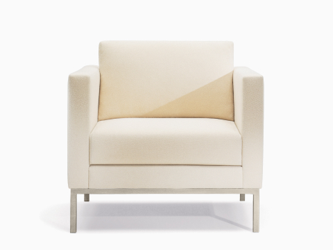 A Riva lounge chair in light textile with brushed metal legs. A Riva lounge chair in light textile with brushed metal legs.
