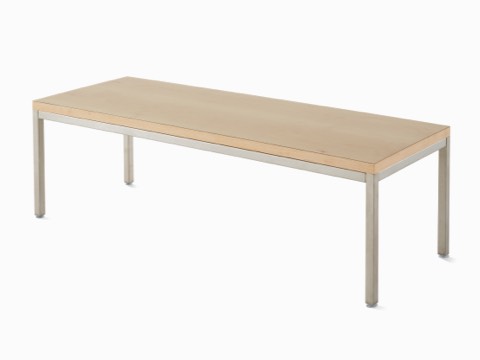Angled view of Riva Coffee Table with a natural maple top and metallic silver base. Angled view of Riva Coffee Table with a natural maple top and metallic silver base.
