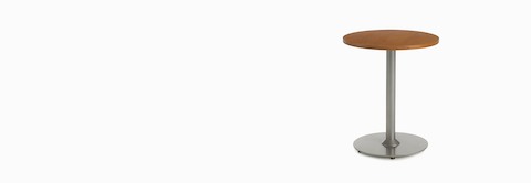 A round Steps End Table with a powder-coated base and laminate top. A round Steps End Table with a powder-coated base and laminate top.