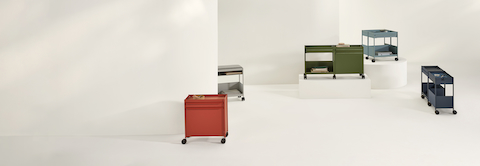 Dark blue, light blue, red and green OE1 Storage Trolleys in various configurations, including casters and glides. Dark blue, light blue, red and green OE1 Storage Trolleys in various configurations, including casters and glides.