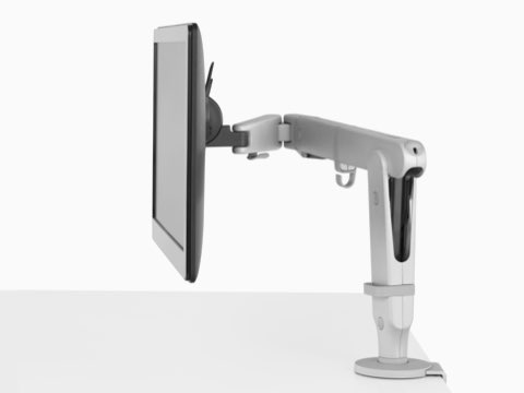 Side view of a monitor supported by a single light gray Ollin Monitor Arm. Side view of a monitor supported by a single light gray Ollin Monitor Arm.