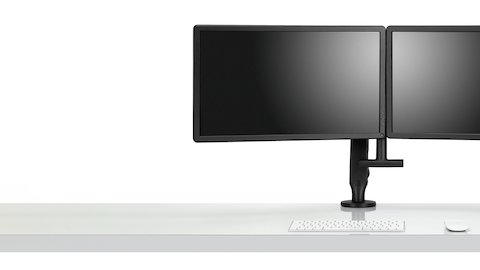 Front view of two monitors attached to a black Ollin Monitor Arm in dual configuration, and with the optional dual bar handle added to support ease of adjustment of screen position. Front view of two monitors attached to a black Ollin Monitor Arm in dual configuration, and with the optional dual bar handle added to support ease of adjustment of screen position.