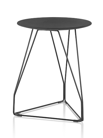 A round Polygon Wire occasional table with a black top and wire base. A round Polygon Wire occasional table with a black top and wire base.