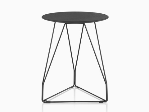 A round Polygon Wire occasional table with a black top and wire base. A round Polygon Wire occasional table with a black top and wire base.