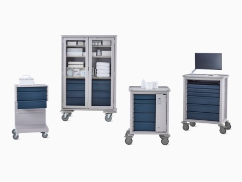 Group of Procedure and Supply Carts including L Cart, double-wide cart, supply cart, and technology cart in light gray body with dark gray drawers. Group of Procedure and Supply Carts including L Cart, double-wide cart, supply cart, and technology cart in light gray body with dark gray drawers.