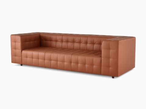 A Rapport three-seat sofa upholstered in leather. A Rapport three-seat sofa upholstered in leather.