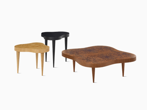 A Rohde Paldao coffee table in walnut burl with Rohde Paldao side tables in oak burl and ebony. A Rohde Paldao coffee table in walnut burl with Rohde Paldao side tables in oak burl and ebony.