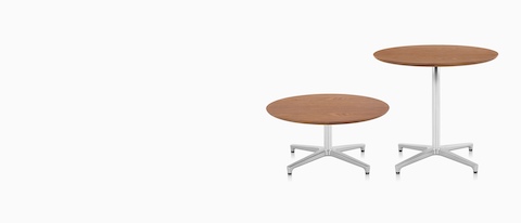 Two round Saiba occasional tables of different heights. Two round Saiba occasional tables of different heights.