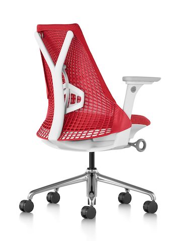 Rear view of a red Sayl office chair, showing the resemblance of the suspension back to a sail. Rear view of a red Sayl office chair, showing the resemblance of the suspension back to a sail.