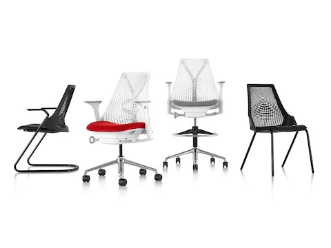 The Sayl seating family: black side chair with sled base, white work chair, white stool, and black stackable 4-leg side chair. The Sayl seating family: black side chair with sled base, white work chair, white stool, and black stackable 4-leg side chair.