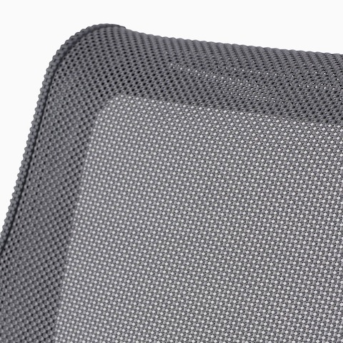 A close-up view of the suspension material on a gray Setu chair. A close-up view of the suspension material on a gray Setu chair.