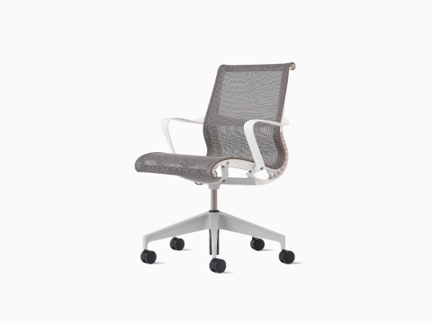 Front-angle view of a Setu Chair with fixed arms and frame in white, base in silver, and suspension in light brown. Front-angle view of a Setu Chair with fixed arms and frame in white, base in silver, and suspension in light brown.