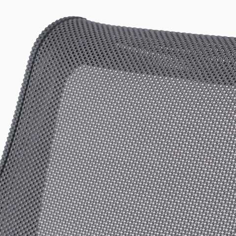 A close-up view of the suspension material on a gray Setu chair. A close-up view of the suspension material on a gray Setu chair.
