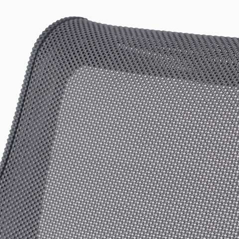 A close-up view of the suspension material on a gray Setu chair. A close-up view of the suspension material on a gray Setu chair.