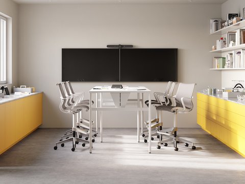Six Setu Stools surround a table in a collaborative workspace. Six Setu Stools surround a table in a collaborative workspace.