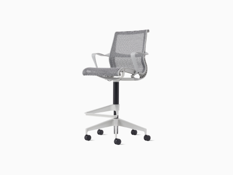 Front-angle view of a Setu Stool with fixed arms, a light gray frame, silver alloy base, and light gray suspension. Front-angle view of a Setu Stool with fixed arms, a light gray frame, silver alloy base, and light gray suspension.