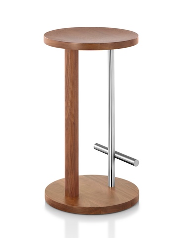 Angled view of a medium-height Spot Stool with a medium wood finish and silver crossbar footrest. Angled view of a medium-height Spot Stool with a medium wood finish and silver crossbar footrest.