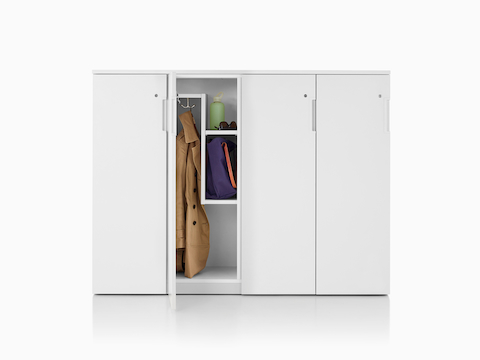 A set of Tu Wood lockers with a Z-interior and an open door showing a jacket and some personal items. A set of Tu Wood lockers with a Z-interior and an open door showing a jacket and some personal items.