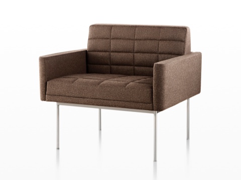 Brown Tuxedo Lounge Seating with quilted fabric upholstery and satin chrome legs, viewed from the front on an angle. Brown Tuxedo Lounge Seating with quilted fabric upholstery and satin chrome legs, viewed from the front on an angle.