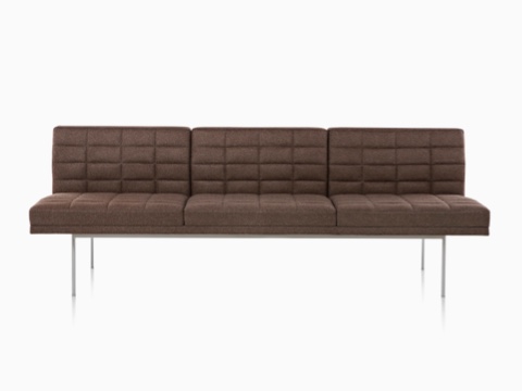 Dark brown Tuxedo Sofa with quilted fabric upholstery, viewed from the front. Dark brown Tuxedo Sofa with quilted fabric upholstery, viewed from the front.