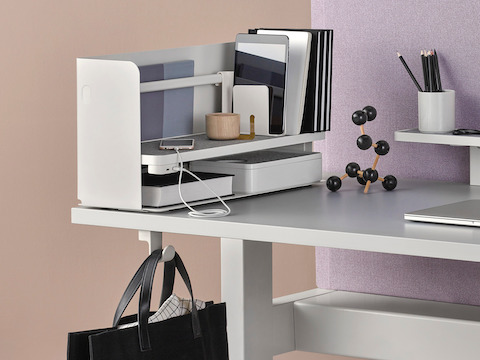 Partial view of a work surface with a Ubi Organizer on top and Ubi Bag Hook below. Partial view of a work surface with a Ubi Organizer on top and Ubi Bag Hook below.