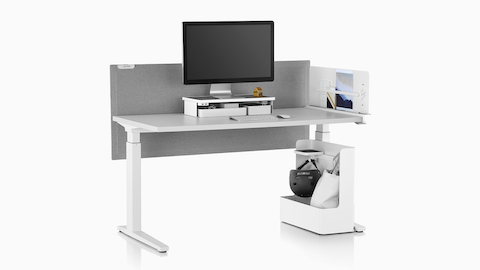 A rectangular sit-to-stand table equipped with Ubi Work Tools, including a Ubi Monitor Platform Shelf and Ubi Mobile Bag Catch. A rectangular sit-to-stand table equipped with Ubi Work Tools, including a Ubi Monitor Platform Shelf and Ubi Mobile Bag Catch.