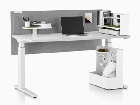 A rectangular sit-to-stand table equipped with Ubi Work Tools, including a Ubi Mobile Bag Catch and desktop organizer. A rectangular sit-to-stand table equipped with Ubi Work Tools, including a Ubi Mobile Bag Catch and desktop organizer.