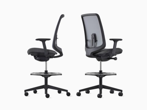 Two black Verus Stools with suspension back viewed from the side and back angle. Two black Verus Stools with suspension back viewed from the side and back angle.
